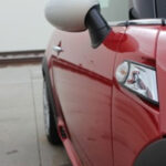 Red car paint less dent removal by PDR-One (after)